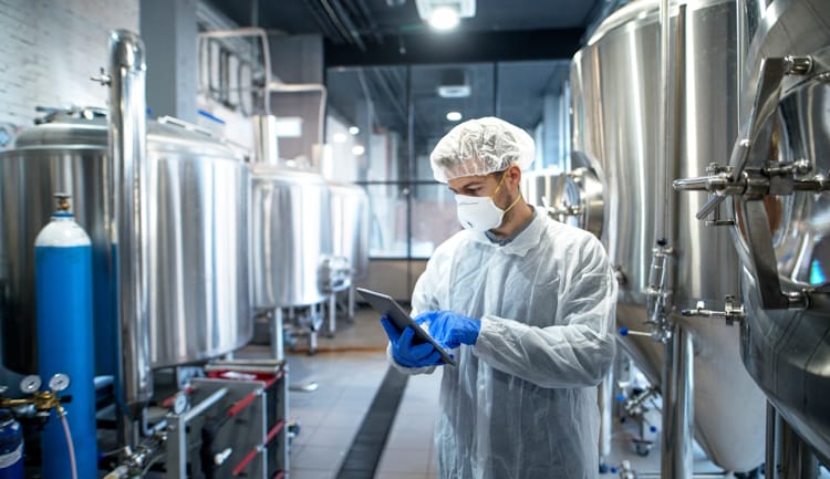 scientist at pharmaceutical manufacturing facility