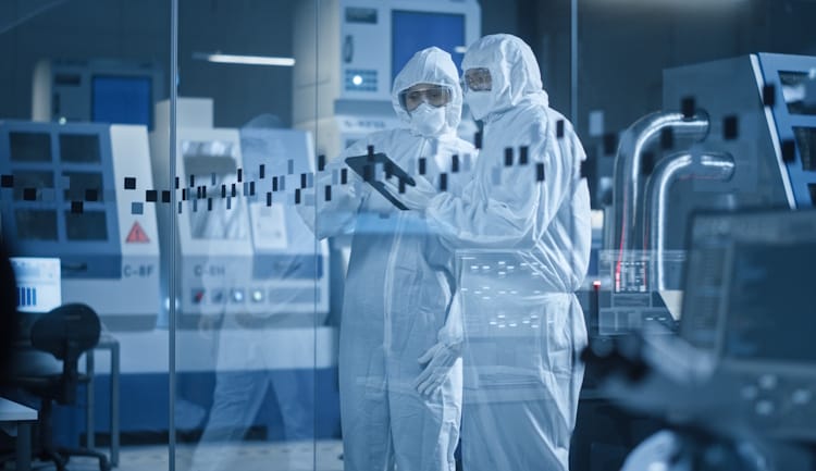 cleanroom workers in PPE gear