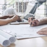 architect and engineering team drawing plans