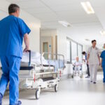 hospital hallway with doctors and nurses