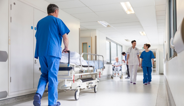 hospital hallway with doctors and nurses